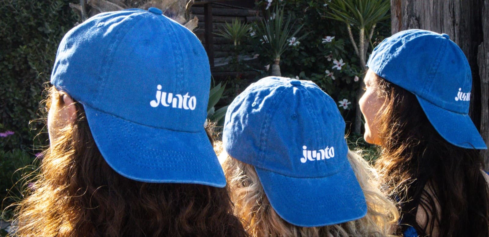 Three travellers in Junto caps on the Lisbon trip